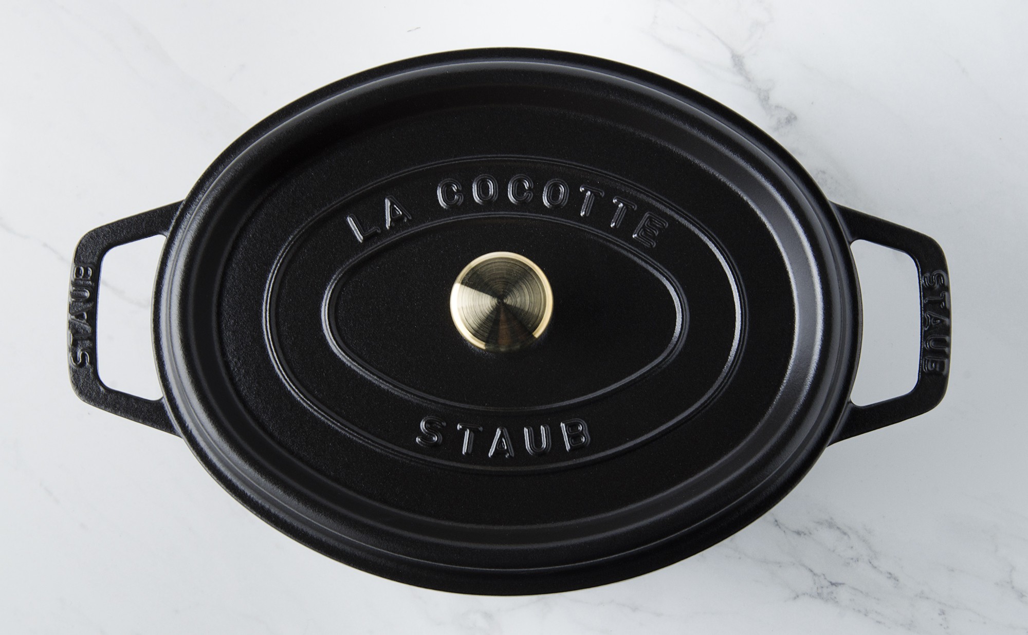 Cocotte ovale 31/38cm, blanc/noir, en fonte d’aluminium, avec revêtement  antiadhérent, sans PFOA, ni PFOS, compatible tous feux dont induction